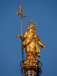 The Madonnina, the little madonna sculpture covered with gold on the highest spire of the Duomo of Milan